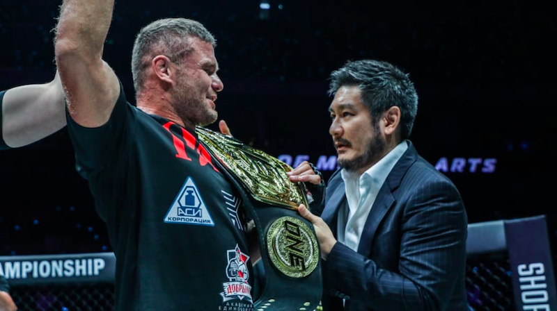 ONE chairman CEO Chatri Sityodtong putting the light heavyweight title on Anatoly Malykhin’s  ONE Championship
