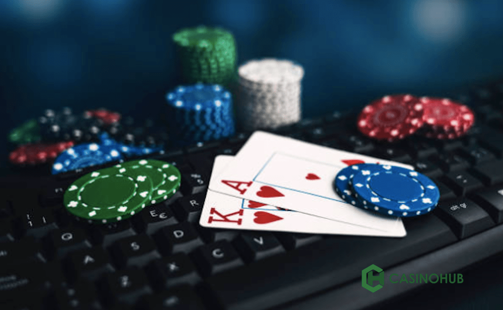 Poker chips, playing cards on keyboard